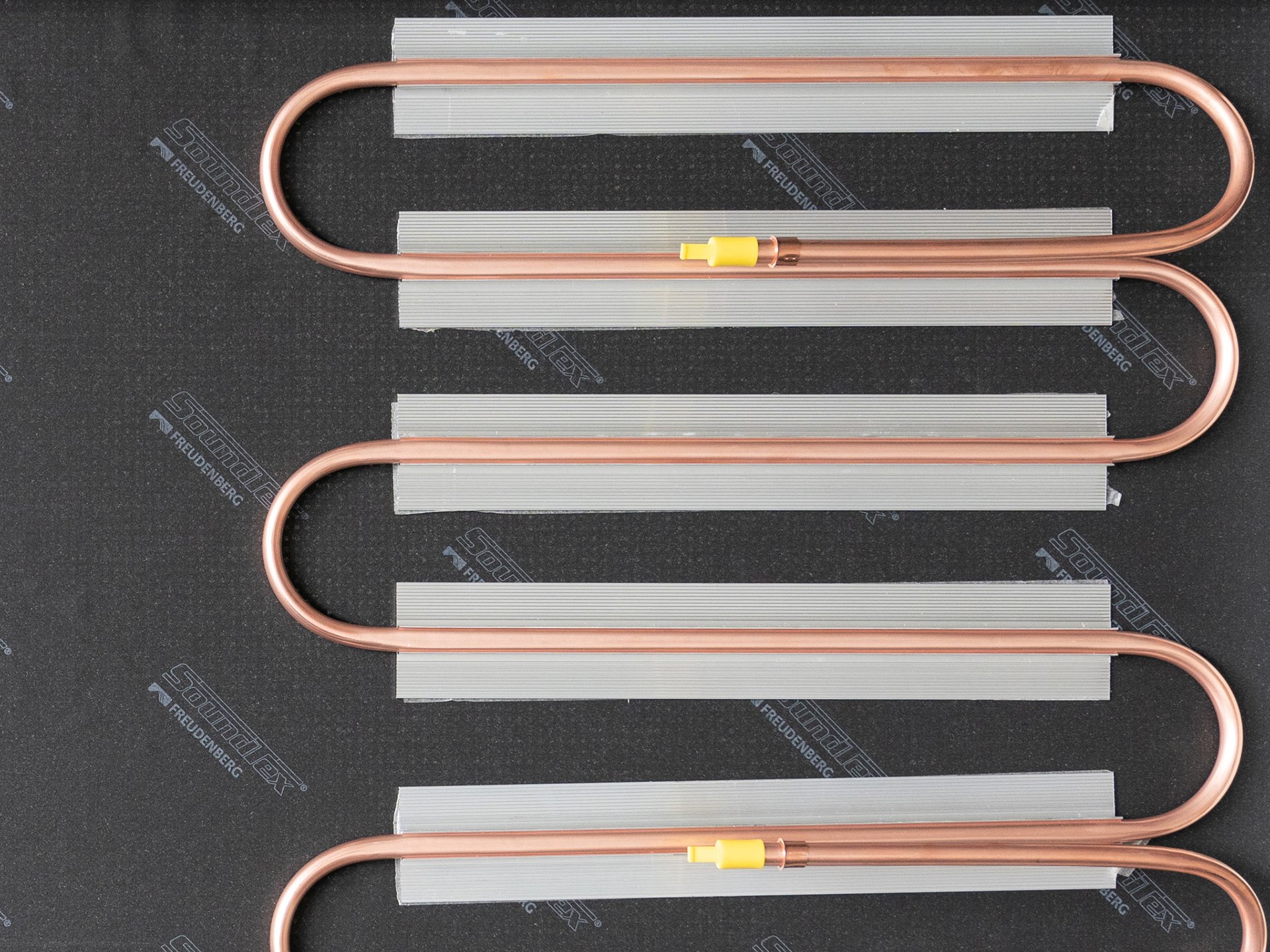Soundtex® acoustic nonwoven integrated into cooling and/or heating system